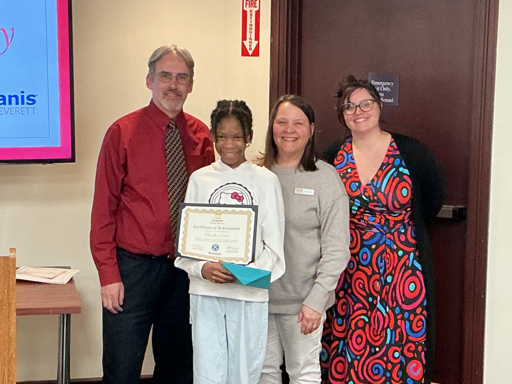Youth Winner Arielle stands with the Director of the Everett Public Libraries, Kevin, and the Children's Librarians, Val and Kristin.