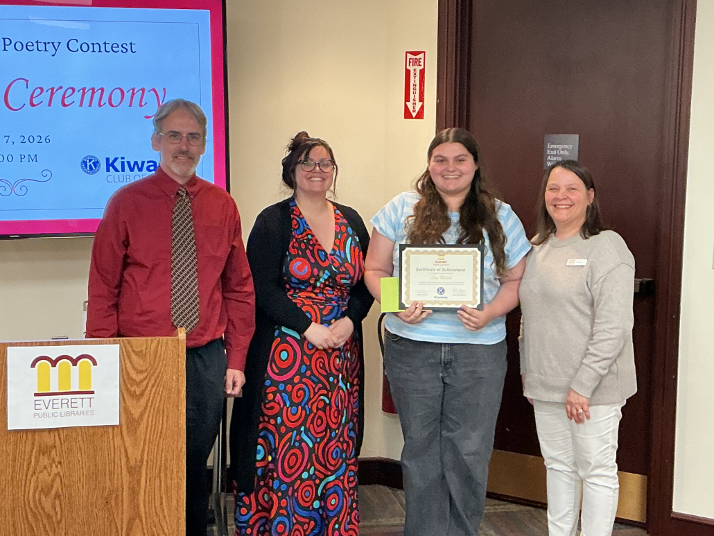 Teen Winner Lee stands with the Director of the Everett Public Libraries, Kevin, and the Children's Librarians, Val and Kristin.