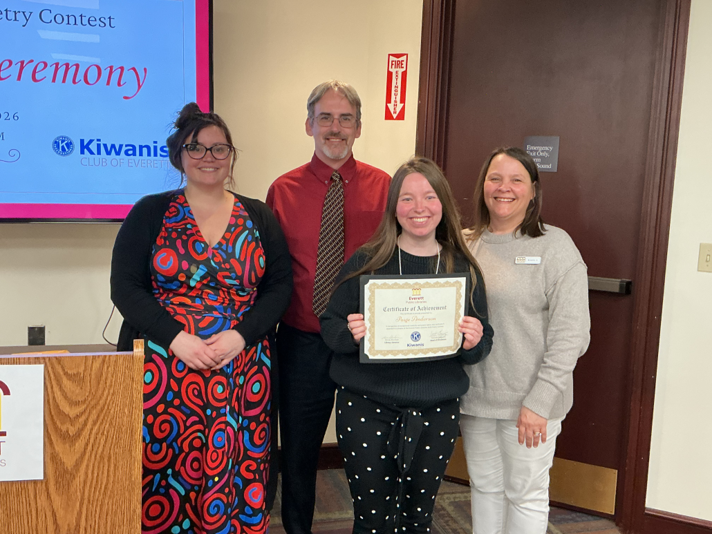 Adult Winner Paige stands with the Director of the Everett Public Libraries, Kevin, and the Children's Librarians, Val and Kristin.